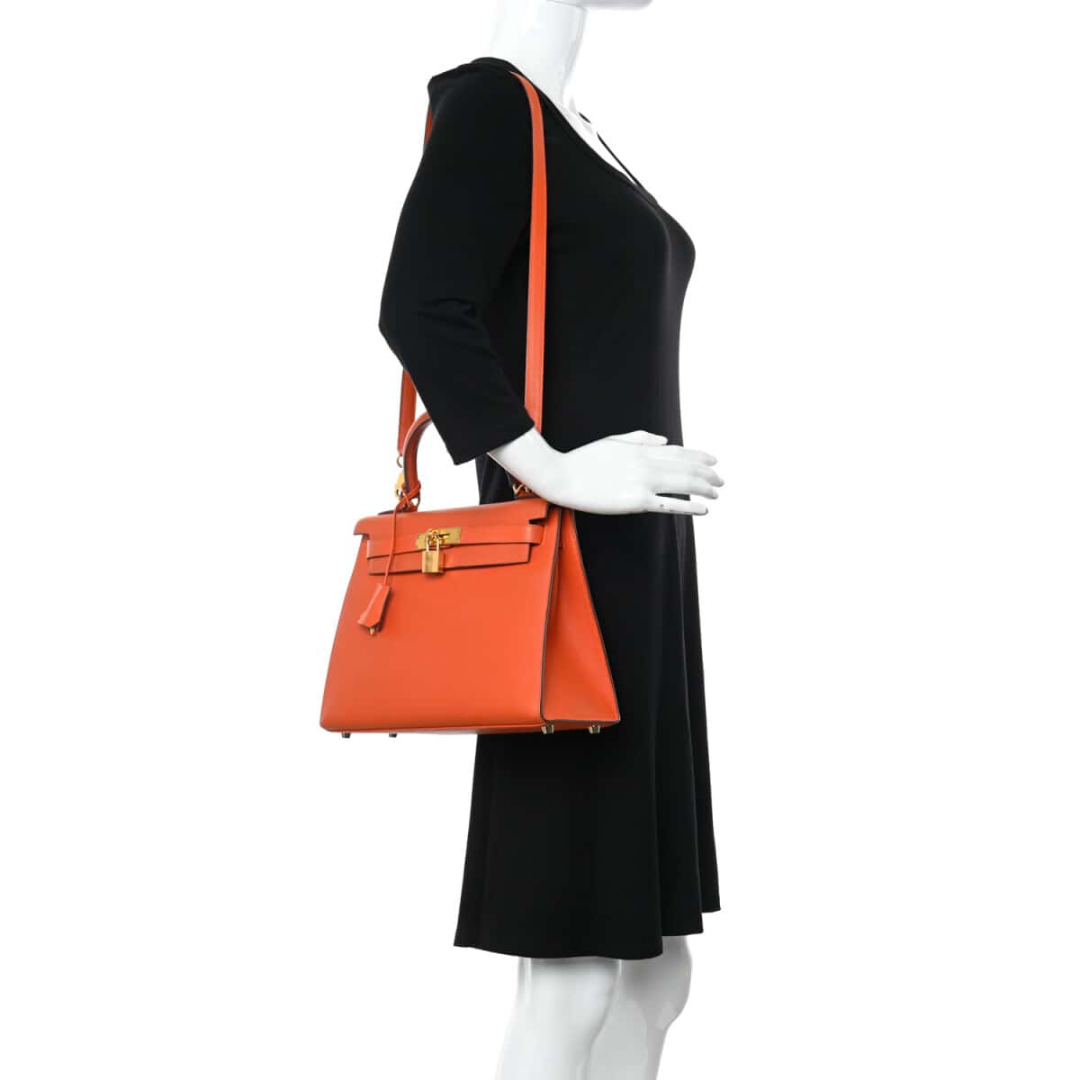 Hermès – Kelly 25 bag in orange with gold-colored hardware